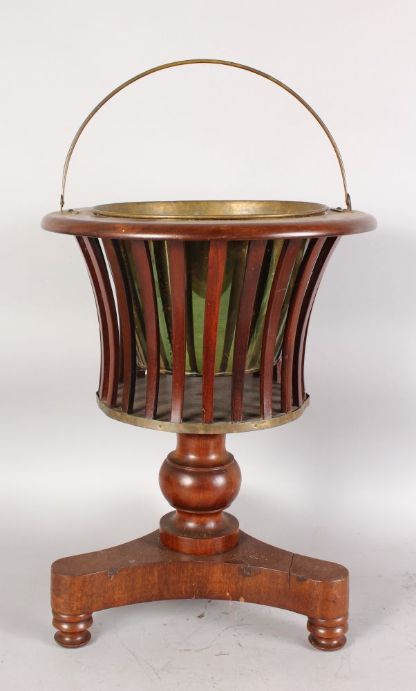 A DUTCH MAHOGANY JARDINIERE, with brass liner, slatted supports on a concave sided base. 1ft 6ins
