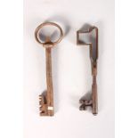 AN UNUSUAL 17TH CENTURY FOLDING KEY, 5.75ins, and A LARGE KEY, 6.25ins (2).