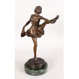 AN ART DECO STYLE BRONZE OF A BALLERINA, her arm and leg outstretched, on a marble base. 1ft 1ins