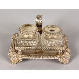 A SUPERB SMALL GEORGE III TWO BOTTLE CHAMBER INKSTAND with gadrooned edge, and shell mounts, on four
