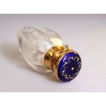 A CUT CRYSTAL AND ENAMEL TOP SCENT BOTTLE. 6cms long.