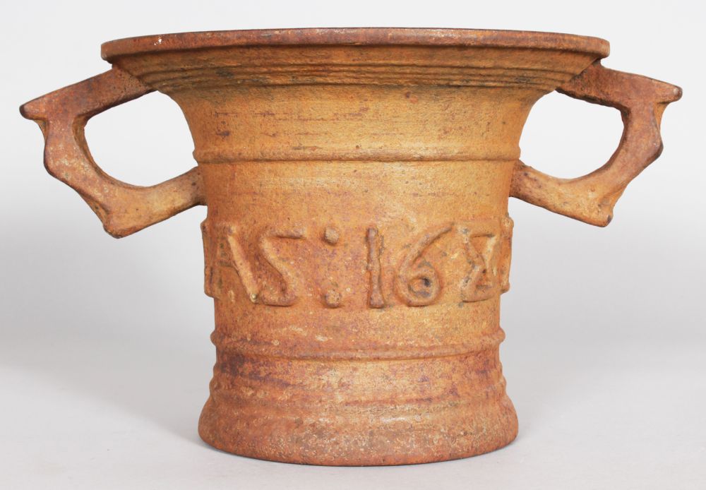 A GOOD LARGE CAST IRON MORTAR inscribed and dated Legas 1688.