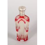 A VICTORIAN RUBY TINTED SCENT BOTTLE with silver top. 3.5ins long.