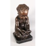 AN AMUSING BRONZE GROUP OF A KNEELING CHILD, a starfish in its hand. 1ft 8ins high.