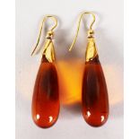 A PAIR OF AMBER DROP PENDANT EARRINGS.