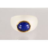 A CRYSTAL, GOLD AND LAPIS SET RING.