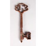 A POLISHED STEEL KEY with pierced handle. 5.5ins.