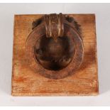 A VERY HEAVY CAST IRON RING KNOCKER. 5ins diameter.