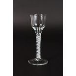 A GEORGIAN WINE GLASS with opaque & twist stem and ogee bowl. 6.5ins high.