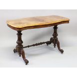A VICTORIAN FIGURED WALNUT SHAPED TOP STRETCHER TABLE, on turned end supports, curving legs with