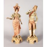 A LARGE PAIR OF ROYAL DUX FIGURES OF A GALLANT AND LADY, Pattern No. 38, standing on scrolled bases.
