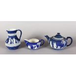 A WEDGWOOD BLUE AND WHITE CIRCULAR JASPER WARE TEAPOT, 5.5ins diameter, impressed WEDGWOOD, a JUG