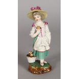 A SMALL 18TH CENTURY HORCH FIGURE OF A YOUNG GIRL carrying a flower. Horch mark. 13cms high.,