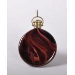 A BOHEMIAN CIRCULAR POLISHED DARK RED PERFUME BOTTLE, CIRCA. 1840, with metal screw top and ring.