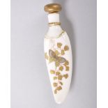 A ROYAL WORCESTER PORCELAIN SCENT BOTTLE shaped like a tigers tooth, decorated with flowers and a