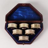 A GOOD SET OF SIX VICTORIAN ENGINE TURNED SERVIETTE RINGS, Numbered 1-6, in a fitted case.