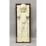 AN EARLY 20TH CENTURY RELIEF CAST PLASTER FIGURE OF A SEMI-NUDE BOY, mounted on an oak board. 3ft