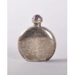 A MINIATURE MEXICAN SILVER FLAT CIRCULAR PERFUME BOTTLE with amethyst stopper, the base marked