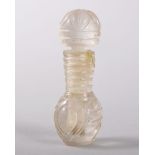 A SMALL 19TH CENTURY INDIAN CUT ROCK CRYSTAL PERFUME BOTTLE AND STOPPER. 5.5cms.