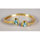 A GOOD GOLD TWO-STONE AQUAMARINE BRACELET.