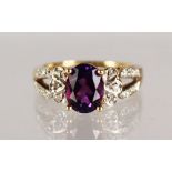 AN 18CT GOLD, AMETHYST AND DIAMOND RING.