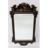 A REGENCY STYLE CHINOISERIE DECORATED MIRROR, with fretwork frame. 2ft 7ins high, 1ft 4ins wide.