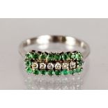 AN 18CT GOLD, EMERALD AND DIAMOND RING.