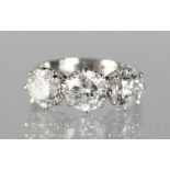 A SUBSTANTIAL 18CT WHITE GOLD THREE STONE DIAMOND RING of 3.5cts.