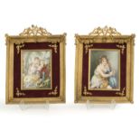 Two framed hand-painted porcelain plaques