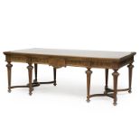 A Louis XVI-style carved walnut library table