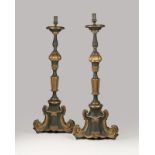 A pair of parcel-gilt and painted torchieres