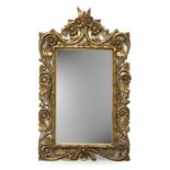 A carved and giltwood wall mirror