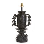 A Chinese bronze table lamp with floral and bird motifs