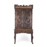 A Chinese export carved hardwood cabinet