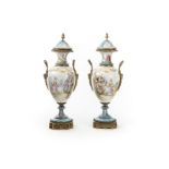 A pair of Paris pocelain lidded urns