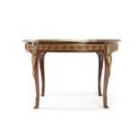 A Louis XV-style gilt bronze-mounted dining table