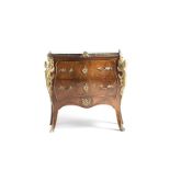 A Louis XV-style gilt bronze-mounted commode