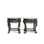 A near pair of Chinese carved hardwood stands