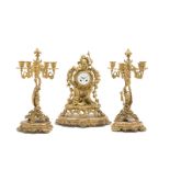 A Louis XV-style gilt-bronze mantel clock and garniture