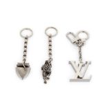 Three designer keychains, Kieselstein-Cord and Louis Vuitton