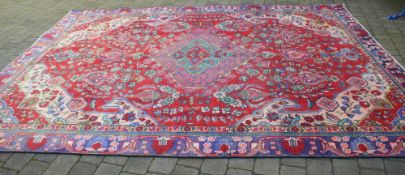 Large red ground persian Tabriz carpet,