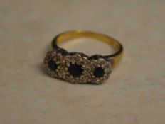 18ct gold sapphire and diamond ring, approx 0.24ct of diamonds and 0.