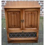 Oak TV cabinet with linen fold panels