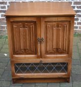 Oak TV cabinet with linen fold panels