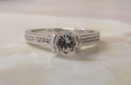 Platinum and diamond ring, centre stone 0.50 ct (shoulder stones total 0.60 ct) weight 3.