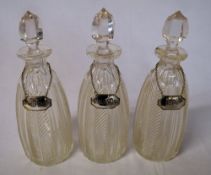 3 decanters with silver labels including Rum,