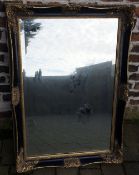 Large ornate black & gilt framed wall mirror 116cm by 75cm