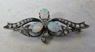 Tested as 18ct diamond and opal brooch