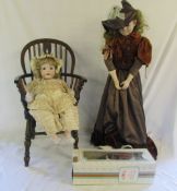 Large doll on stand,
