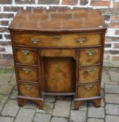 Georgian walnut veneer bow fronted knee hole desk with swan neck handles on bracket feet with cock